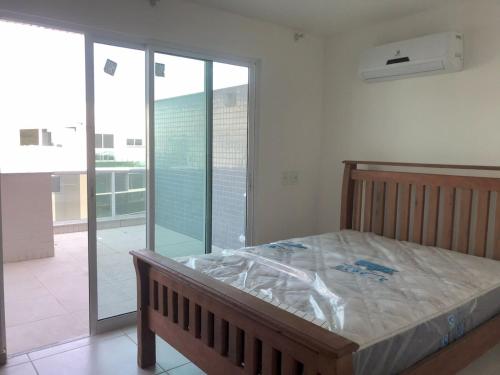 Cama ou camas em um quarto em Lebon Vivant cobertura vista mar