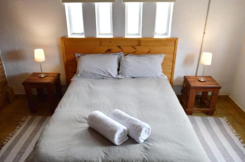 Una cama o camas en una habitación de El Calafate Sher Apart