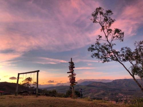 a pole on top of a hill with a swing at El Pueblito Hotel Boutique in Samaipata