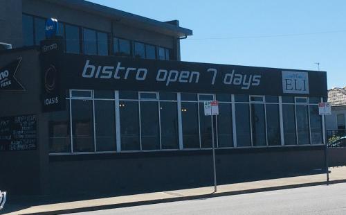 a building with a sign that reads boston open seven days at Elimatta Hotel in Devonport