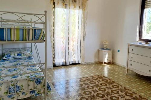 Ένα ή περισσότερα κρεβάτια σε δωμάτιο στο Villa Aurora, splendida vista mar Jonio Taranto