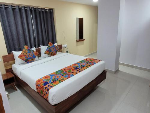 a bedroom with a large bed in a room at Hotel Prime Jubilee in Hyderabad