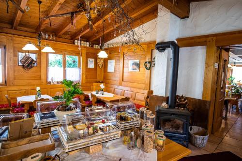 a large room with a fireplace in a restaurant at Hotel-Hauensteiner-Hof in Hauenstein