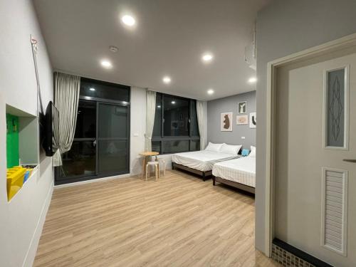 מיטה או מיטות בחדר ב-MiShi 85 Guest House