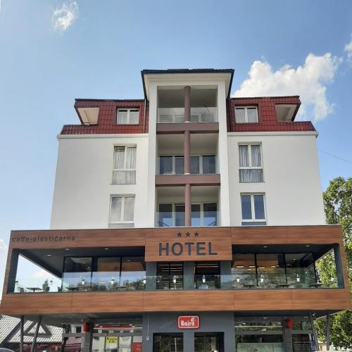 a building with a hotel on top of it at Motel Bajra in Travnik