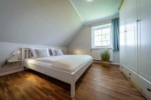 Postel nebo postele na pokoji v ubytování "Ferienhof Seelust" Ferienwohnung 4