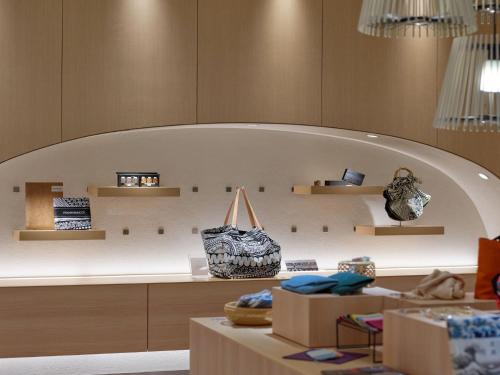 a store with a large wall with shelves at Portom International Hokkaido in Chitose