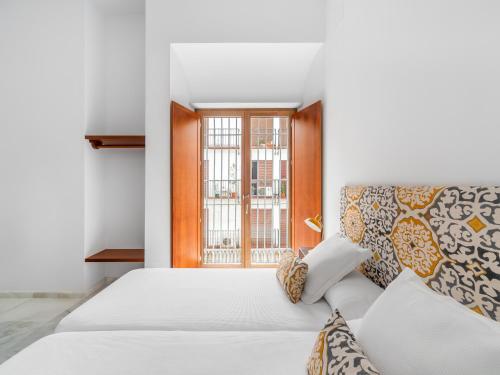 Postel nebo postele na pokoji v ubytování numa I Molina Apartments
