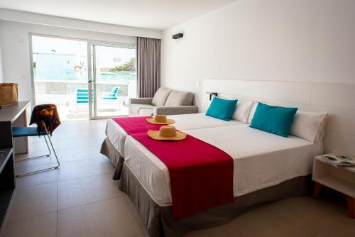 מיטה או מיטות בחדר ב-Hotel Taimar