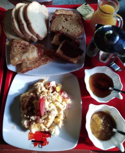 a table with three plates of food on it at Nefeles in Neochori