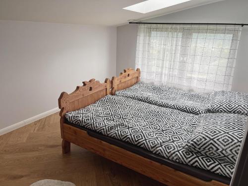 Postel nebo postele na pokoji v ubytování Apartamenty Pod Kątami