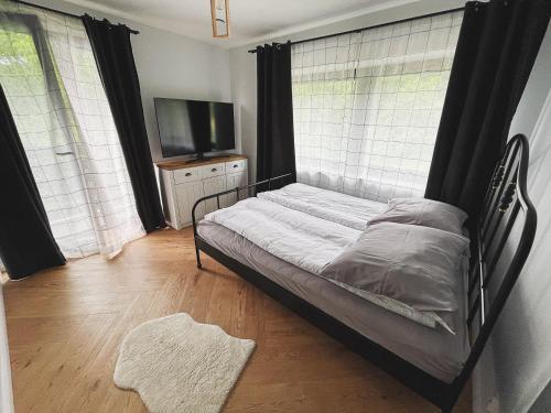 Postel nebo postele na pokoji v ubytování Apartamenty Pod Kątami
