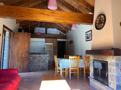a living room with a table and a fireplace at Casa Sansón in Chía