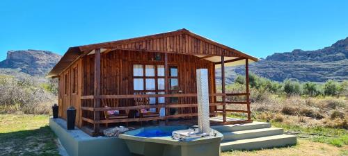 a small wooden building with a hot tub in it at de Pakhuys in Clanwilliam