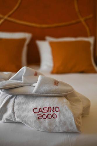 a pair of towels sitting on top of a bed at Casino 2000 - Adult Guests Only in Mondorf-les-Bains