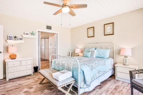 a bedroom with a bed and a ceiling fan at Blue Umbrella in Daytona Beach Shores