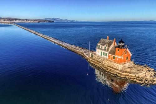 a house on a pier in the water at Rockledge in Clark Island
