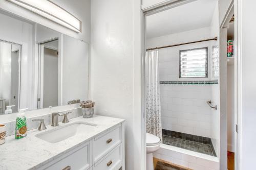 a white bathroom with a sink and a toilet at Kona Bali Kai #265 in Kailua-Kona