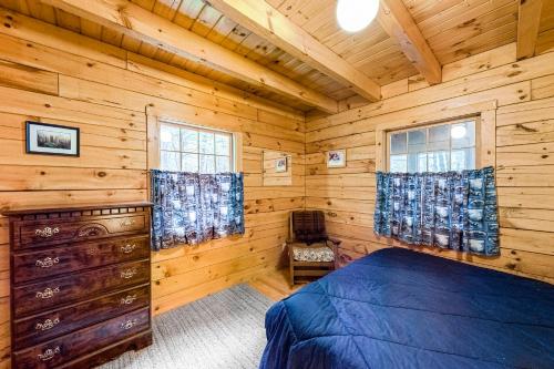 En eller flere senger på et rom på Lake View Cottage