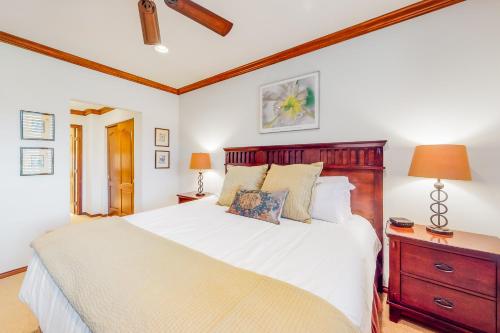 a bedroom with a large white bed and a wooden headboard at Arrowhead Condos in Edwards