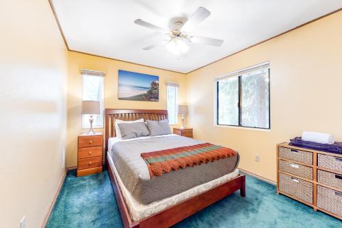 a bedroom with a bed and a ceiling fan at Morrison Manor in Lake Arrowhead