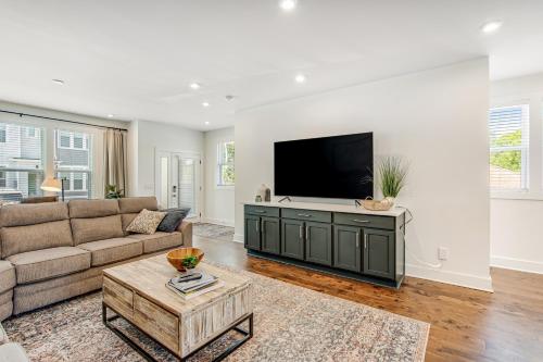 a living room with a couch and a flat screen tv at Creative Way Village - Nashville Holidays in Nashville