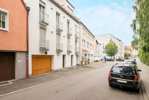 a car parked on the side of a street at Apartments Ingolstadt Bauhofstraße in Ingolstadt