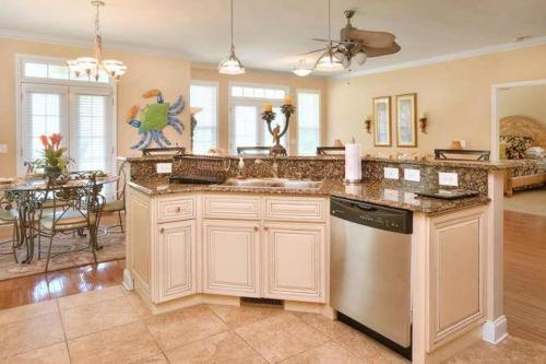 a kitchen with a sink and a dishwasher at A Gift From Heaven in Oak Island