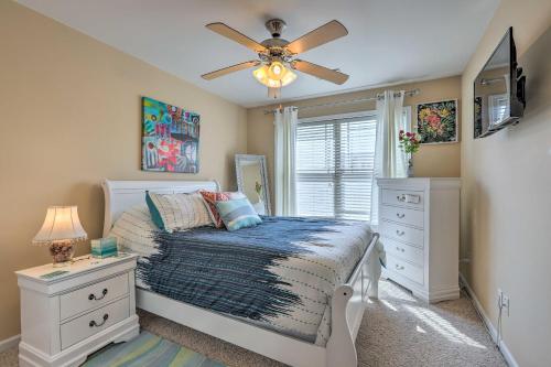 a bedroom with a bed and a ceiling fan at Macon Townhome with Patio, 5 Miles to Downtown! in Macon