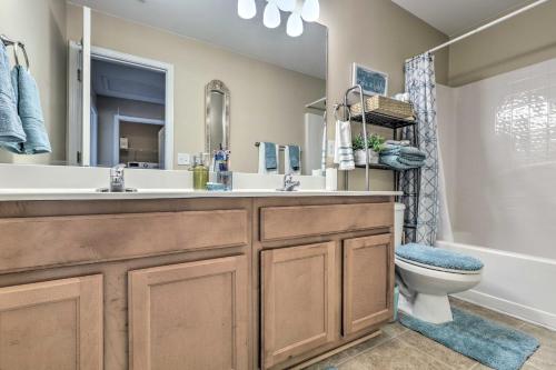 a bathroom with a sink and a toilet at Macon Townhome with Patio, 5 Miles to Downtown! in Macon