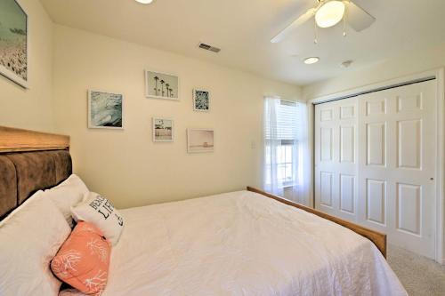 a bedroom with a white bed and a white door at Brigantine Condo - Steps to the Ocean! in Brigantine