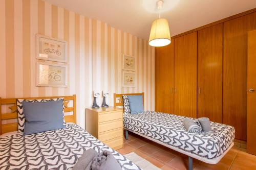 A bed or beds in a room at Duplex Paraiso Dream - TENESOL RENTALS