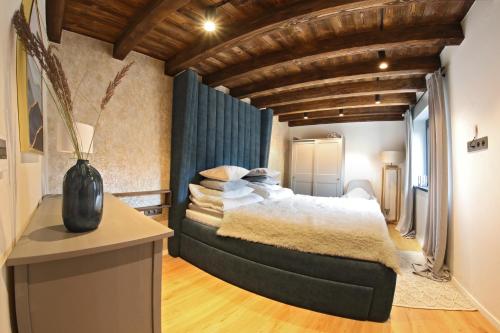 a bedroom with a large bed in a room at Vila Pohoda in Donovaly