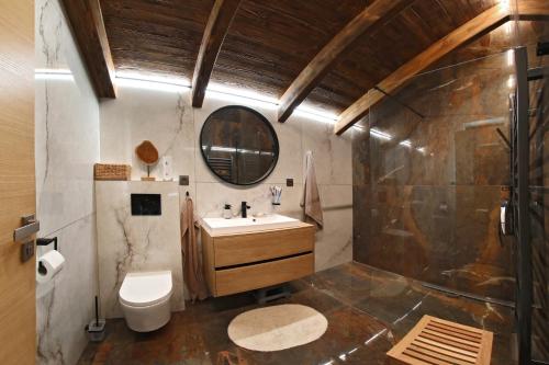 a bathroom with a sink and a toilet at Vila Pohoda in Donovaly