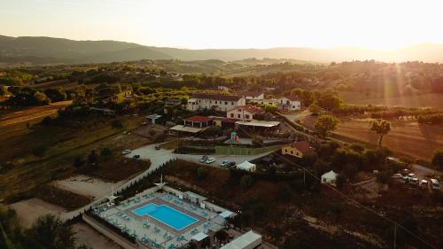 an aerial view of a house with a swimming pool at Il Pozzo Country House in Collescipoli