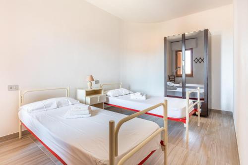 Postel nebo postele na pokoji v ubytování Casa Vacanza S'Archittu