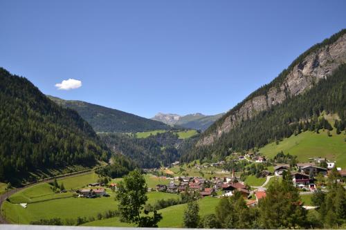 a small village in a valley in the mountains at Ferienwohnung Eller 79 in Vals