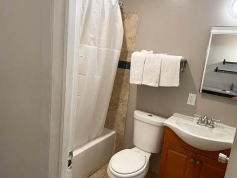 a bathroom with a toilet and a sink and a shower at Studio 6 North Las Vegas, NV in Las Vegas