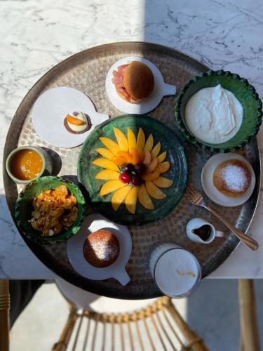a table with plates of food on a table at Santa Lucia Maccarese - Residenza Agricola in Maccarese