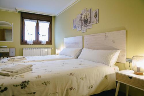 Posteľ alebo postele v izbe v ubytovaní Alojamiento Urabain