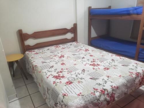 En eller flere senger på et rom på Apartamento Guarapari