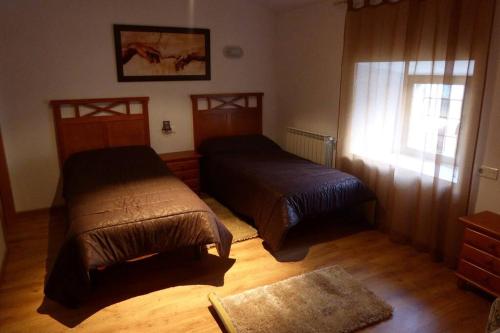Un pat sau paturi într-o cameră la Casa Rural El Silvestrito