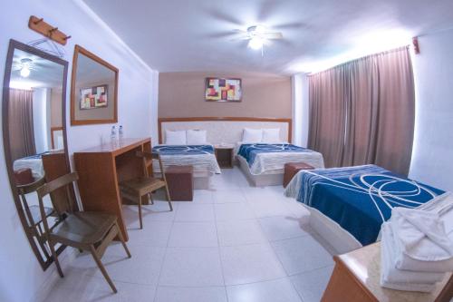 Postel nebo postele na pokoji v ubytování Hotel Niza Zona Piel