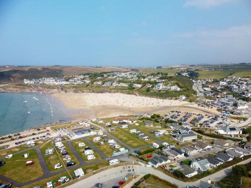 an aerial view of a beach with a parking lot at Megizzy in Polzeath