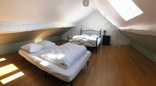 Postel nebo postele na pokoji v ubytování Gite Aubusson