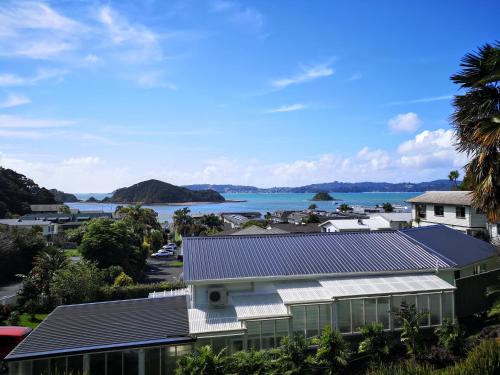 an aerial view of a town with a body of water at Abri Apartments in Paihia