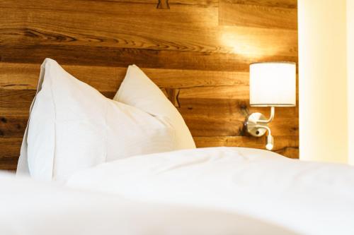 Postel nebo postele na pokoji v ubytování Hotel Die Metzgerstubn