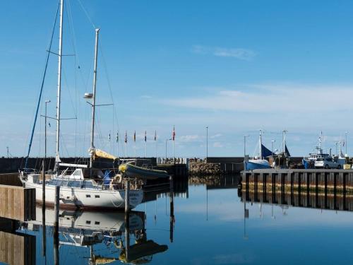 a group of boats are docked at a dock at 6 person holiday home in Glesborg in Glesborg