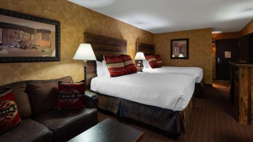 A bed or beds in a room at Best Western Plus Inn of Santa Fe