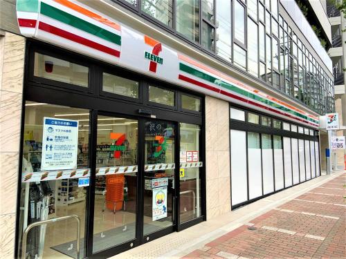 a store front of a building with glass windows at HOTEL TAVINOS Kyoto in Kyoto